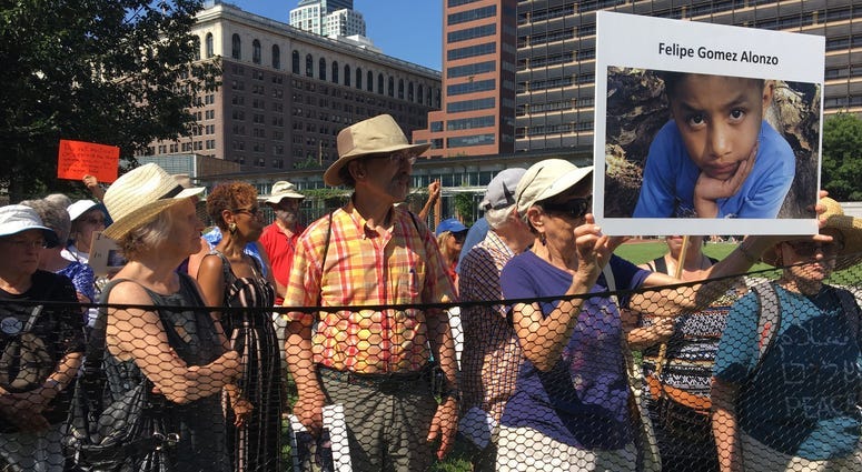Seniors protest US treatment of migrant kids by 'caging' themselves in excessive heat